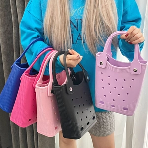 Close-up of waterproof EVA beach bags in multiple colors with breathable hole patterns