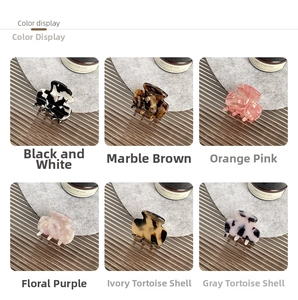 Detailed color display of six mini acetate hair claws in various stylish marble patterns