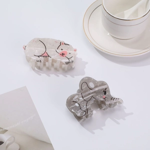 Cute animal hair clips featuring a white cat and grey elephant in acetate material