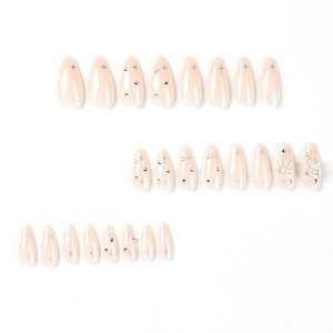 Press-on nails with 3D bowknot, silver stars, and rhinestones in almond shape