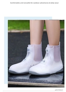 Detail of waterproof white silicone shoe covers with side buckles and non-slip grey soles