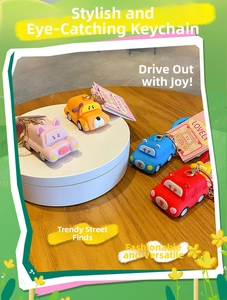 Set of four colorful cartoon animal car keychains including pig, dog, and bear designs
