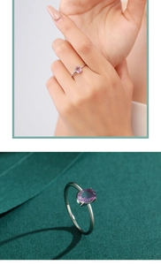 Detailed macro view of an oval purple gemstone set in a refined S925 silver ring