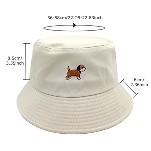 Beige cotton bucket hat with dog embroidery and detailed size measurements display