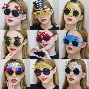 Glittery Happy New Year party glasses in 9 styles featuring stars hearts and crowns