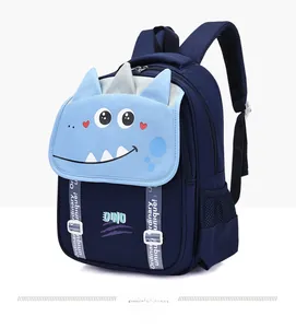 Close-up of blue cartoon dinosaur schoolbag featuring waterproof fabric and mesh side pocket