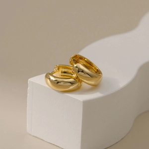 Minimalist 18K gold plated thick hoop earrings on clean geometric stands