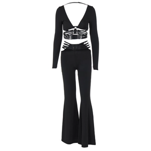 Detail of black two-piece set featuring cutout tie-waist design and flared trousers