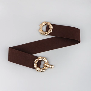 Detailed view of a brown elastic waist belt featuring a twisted gold metal buckle