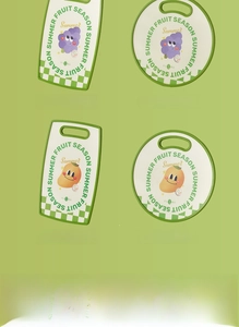 Detail showing non-slip edges and hanging handles of fruit themed plastic cutting boards