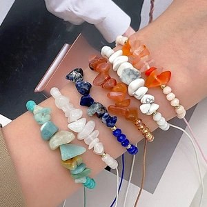 Close-up of handmade natural colorful gemstone bead bracelet worn on a female wrist