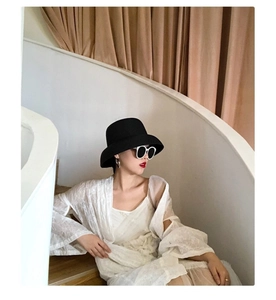 French Hepburn style black straw hat with small brim for summer beach sun protection