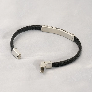 Vintage leather cord bracelet with stainless steel cross plaque and metal clasp