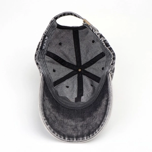 Detail of internal six-panel construction and 100% cotton label on washed denim cap