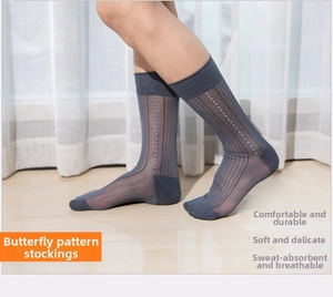 Detailed close-up of dark grey sheer nylon business socks with ribbed pattern and dots