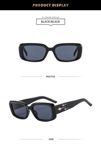 Detail of black rectangular sunglasses with silver star motifs on the side temples