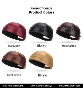 Flat lay of vintage PU leather docker hats in five colors including burgundy and brown