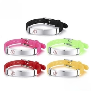 Close-up of silicone medical ID bracelets with metal engraving plates in five colors