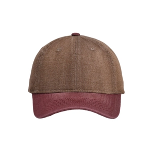 Detail of a two-tone baseball cap with brown crown and dark red brim in washed denim fabric
