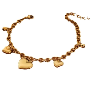 Golden double chain bracelet with shiny heart pendants and bell charms for women