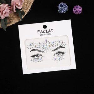 Macro view of iridescent crystal face gems with teardrop and round rhinestones for party makeup