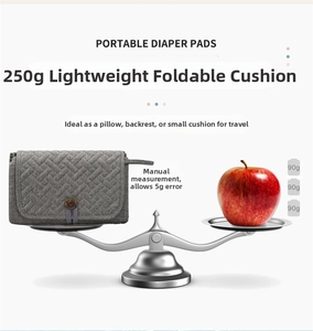 Lightweight 250g portable grey quilted baby changing mat with elegant wooden button closure