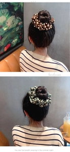 Detail of brown polka dot and green vintage pattern linen fabric scrunchies on hair