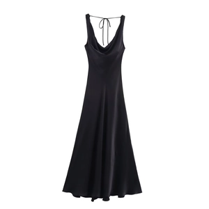 Detail of elegant black satin long dress featuring silky fabric and delicate strap ties