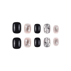 Glittering black and pink gradient press-on nails with silver stars and 3D rhinestones