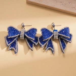 Exquisite blue bow knot stud earrings with shimmering crystals and silver needles