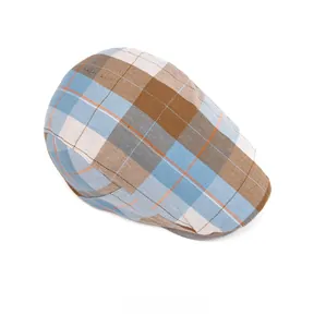 Top-down view of a classic plaid flat cap featuring blue, tan, and cream checkered patterns