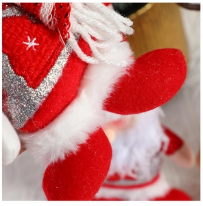 Detailed macro of red plush Christmas decor with white faux fur and silver glitter snowflake