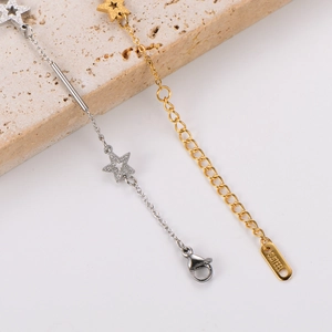 Minimalist gold and silver stainless steel star charm bracelets on stone base