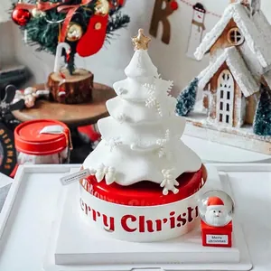 Creative Christmas cake border featuring Merry Christmas cutout with a snowy tree design