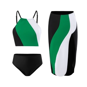 Detailed view of the three-piece swimsuit set with bold green and black color blocking