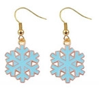 Close-up of golden Christmas earrings featuring light blue enamel snowflake charms