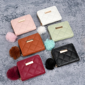Quilted women's coin purses in six colors with decorative fur pompom zipper pulls