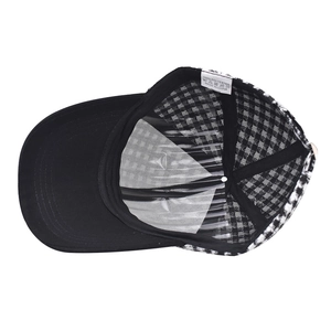 Thick black and white plaid baseball cap with polyester lining and structured shape