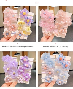 Detalle del juego de 10 gomas de pelo con flores de colores para niñas en tela suave