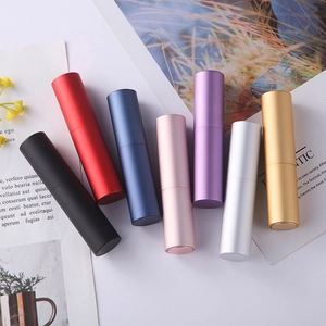 Rotating refillable perfume spray bottles in multiple metallic colors on white background
