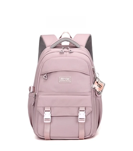 Close-up of the pastel purple travel backpack with front flap pocket and heart charm