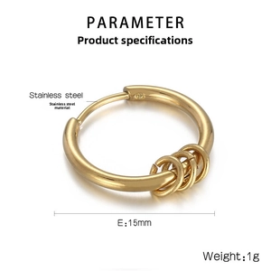Detail of 15mm gold stainless steel hoop earring with three small removable rings