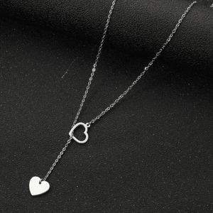 Elegant silver stainless steel Y-shaped necklace with hollow and solid heart pendants