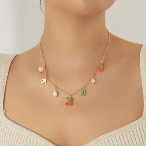 Gold stainless steel necklace with cherry, strawberry, and pearl fruit-themed charms