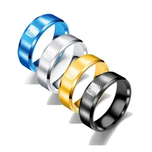 Detailed view of four-color braided cable bracelets with engraved heart charms in steel