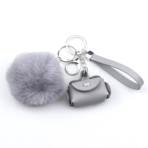 Fashionable grey PU leather mini bag keychain with plush pom pom and wristlet strap set