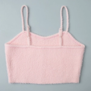 Close-up of pink fuzzy knit crop top featuring soft faux fur texture and ribbed details