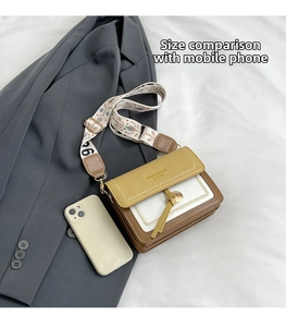Size comparison of a color-block crossbody bag with wide bohemian strap and smartphone