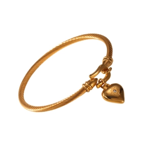 Gold-plated twisted bangle featuring a heart charm with a sparkling central crystal