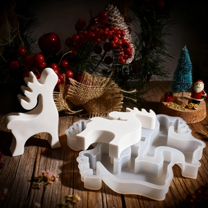 Christmas reindeer silicone mold for DIY resin candles and gypsum crafts on wood table